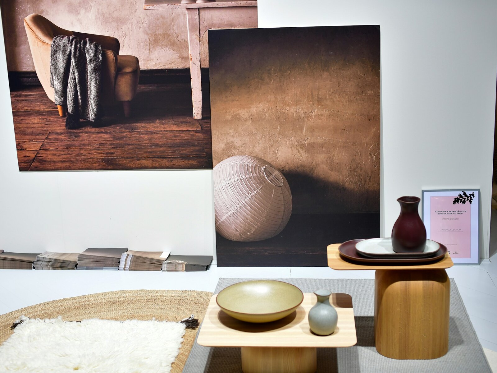 Folded blankets and bolsters on a wooden shelf